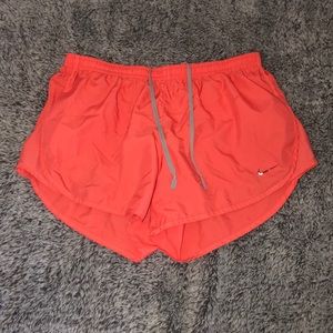 coral color nike shorts